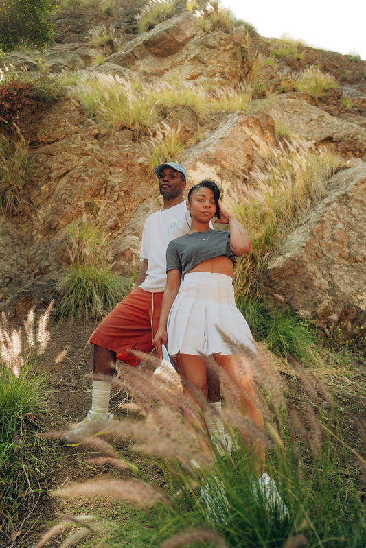 HVNS CROP TOP; HVNS TENNIS SKIRT; "YUCK" TEE; PAINT DAB CAP; WAX RED CLAY SHORT